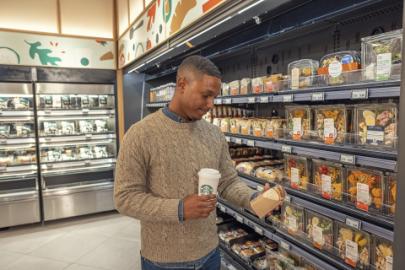 a person standing in front of a store