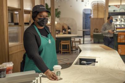 a woman standing in front of a table