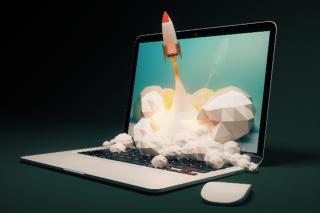 rocket ship and laptop