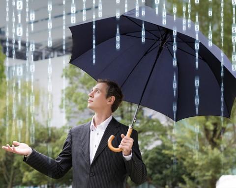 a person that is standing in the rain holding an umbrella