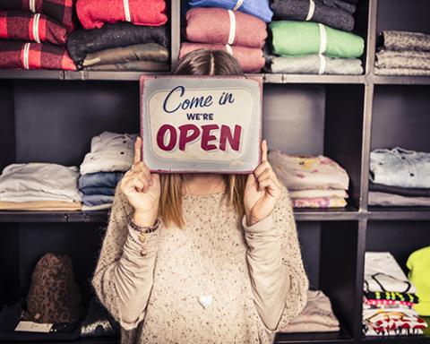 a person standing in front of a store