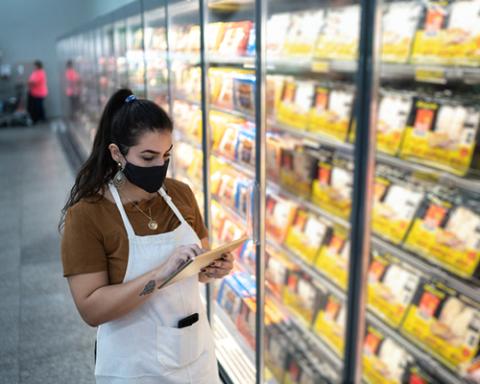 a woman standing in front of a store