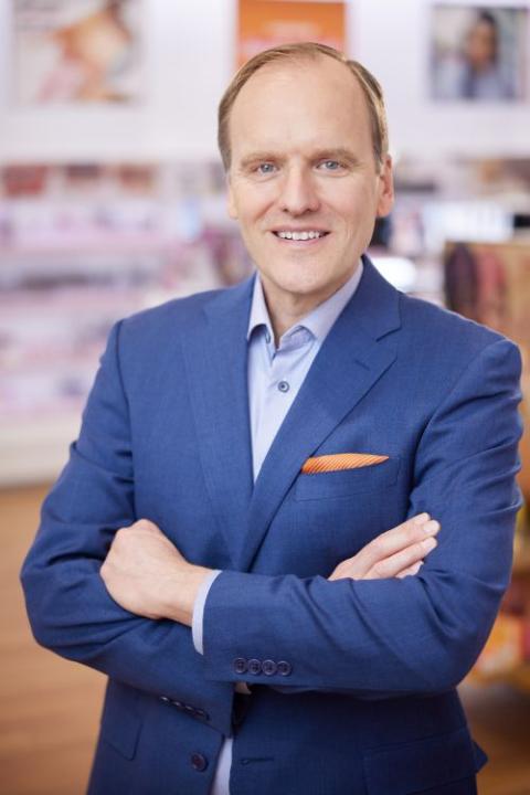 Dave Kimbell wearing a suit and tie