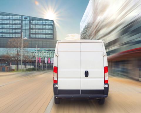 a van driving down a street