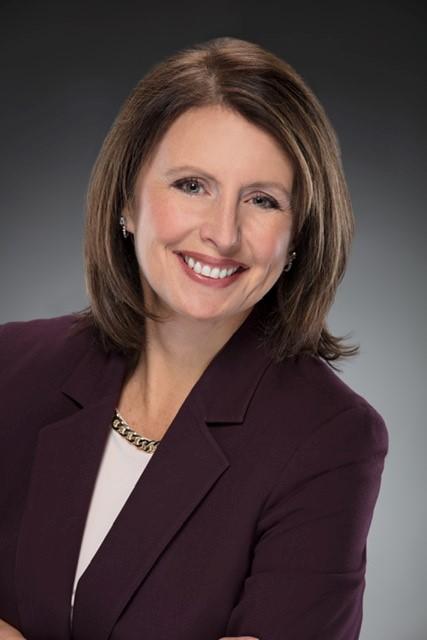 a woman smiling for the camera