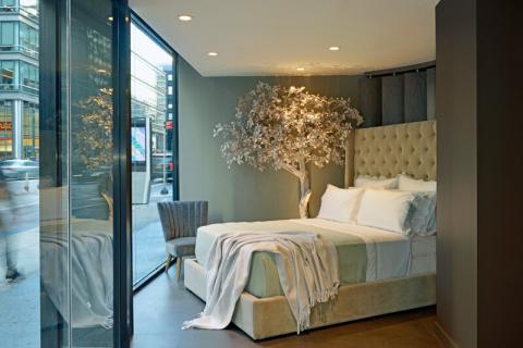 a bedroom with a large bed in a room