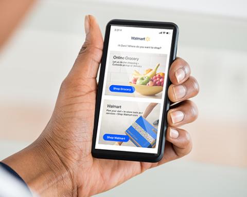 a hand holding a cell phone