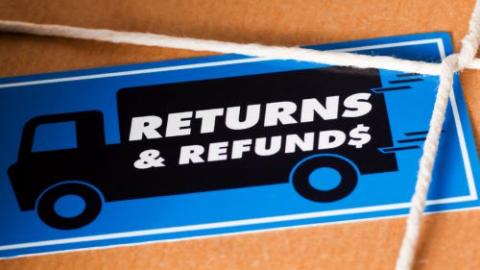 Returns and refunds sticker on cardboard box